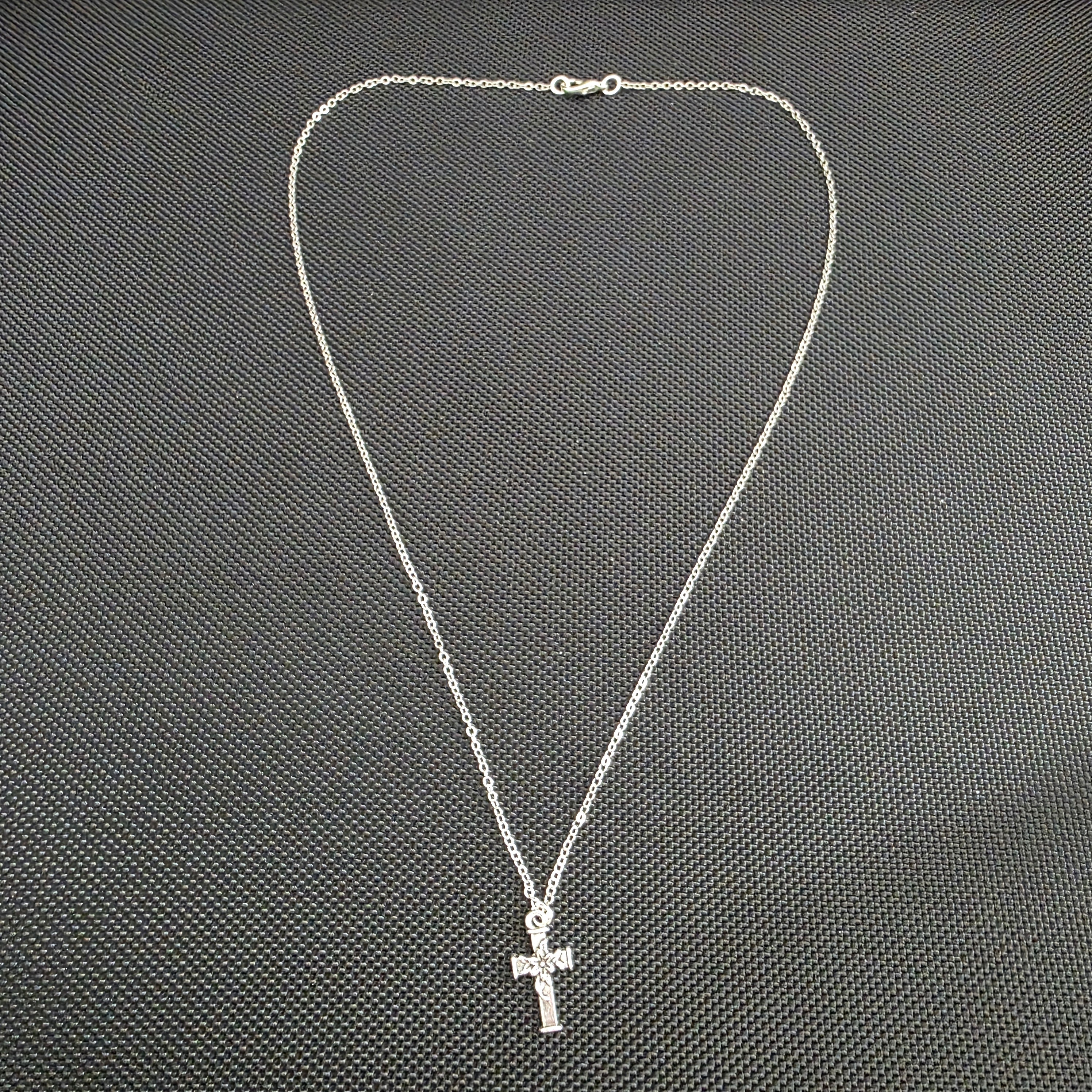 Cross with flower necklace